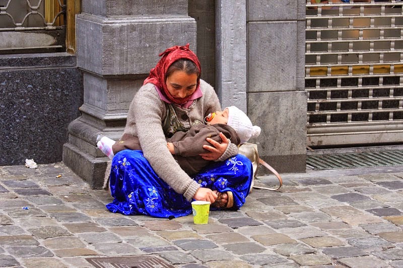 Why is the child in hands of the beggar always sleeping?